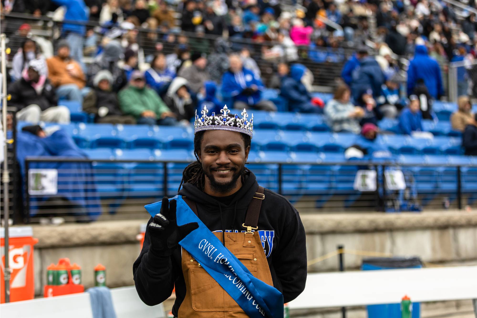 student wearing a crown after being named homecoming royal